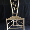 Gentleman's chair with winter branches back and paper rush seat