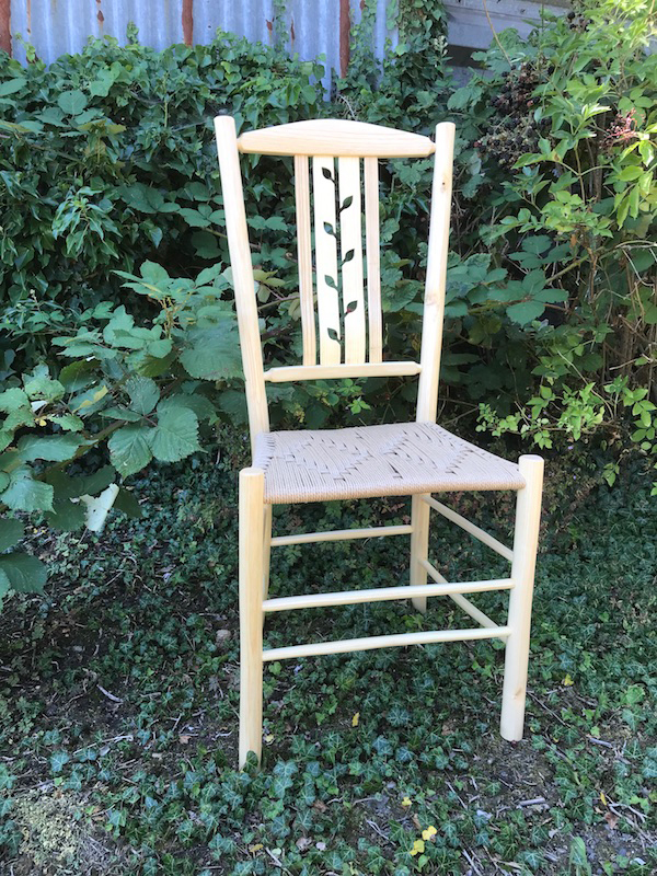 Negative leaf lath back dining chair with danish cord seat