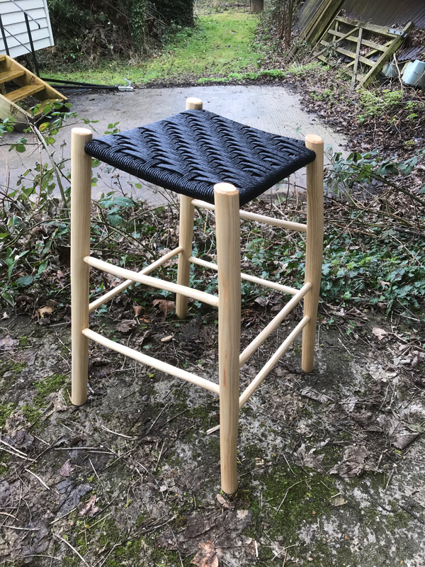 sloping perching stool with black danish cord seat
